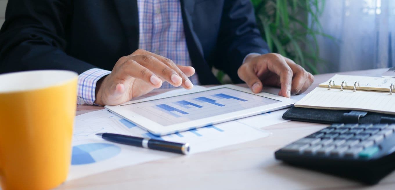 A person using their real estate website audit to improve their agency.
